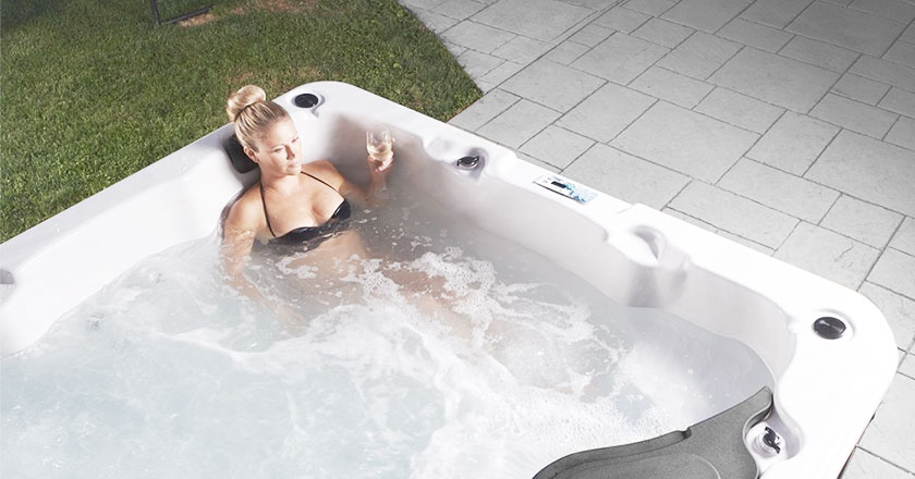 Women with a glass of white wine in Strong Spas hot tub