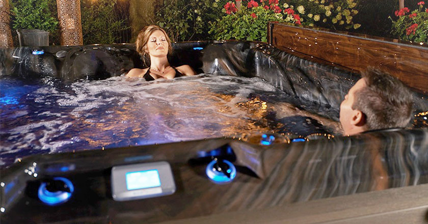 Woman and Man enjoying their Strong Spas hot tub