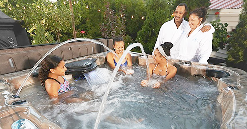 Family enjoying a Strong Spas hot tub